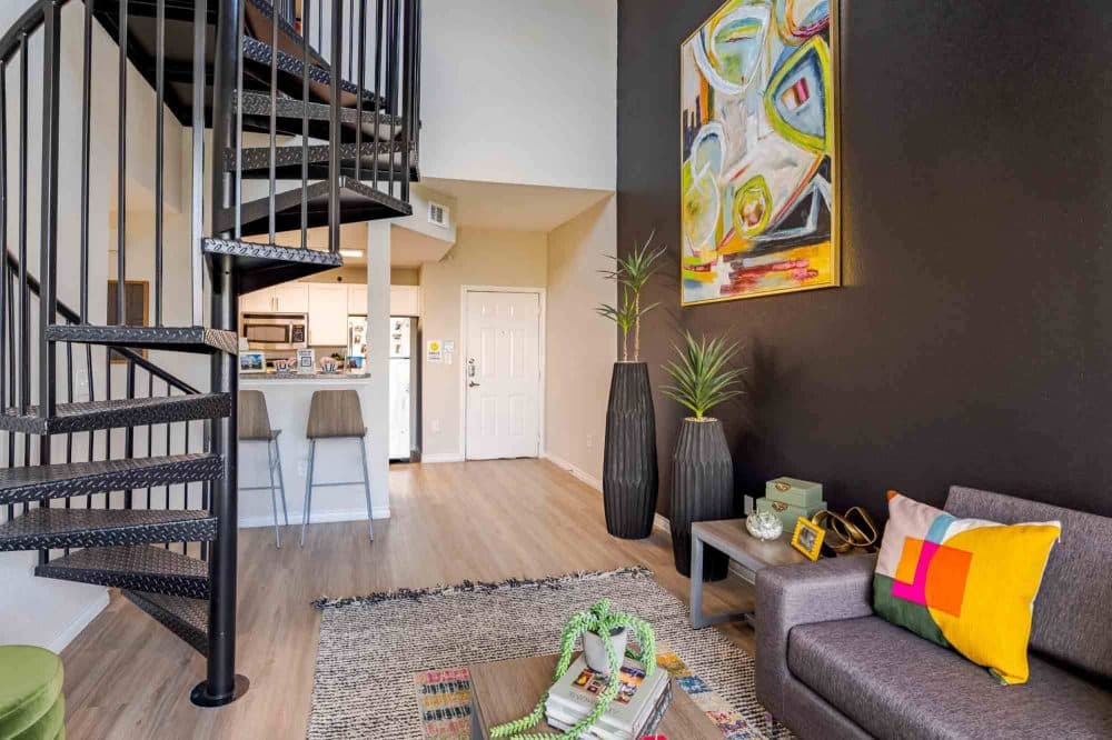 21 Pearl Apartments Near UT Austin Furnished Living Room and Kitchen Spiral Staircase
